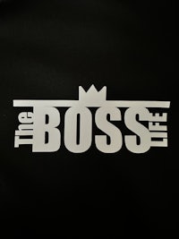 the boss life logo on a black background