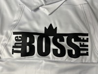 a white jacket with the boss life logo on it