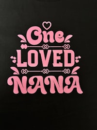 a black shirt with the words one loved mama on it